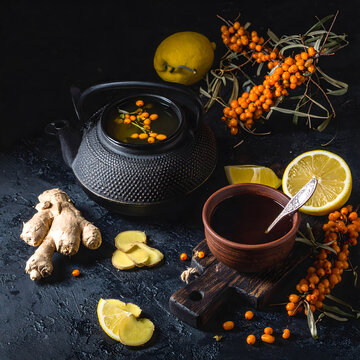 Rustic Sea Buckthorn Tea Still Life Banner with Cast Iron Teapot and Ginger.