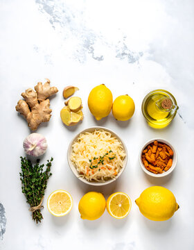 Flatlay Banner of Healthy Natural Ingredients Oil Honey Lemon Ginger and Sauerkraut.