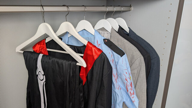 Halloween costumes stored in a wardrobe with everyday clothes. 
