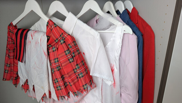 Halloween costumes hanging in a wardrobe ready for a costume party. 