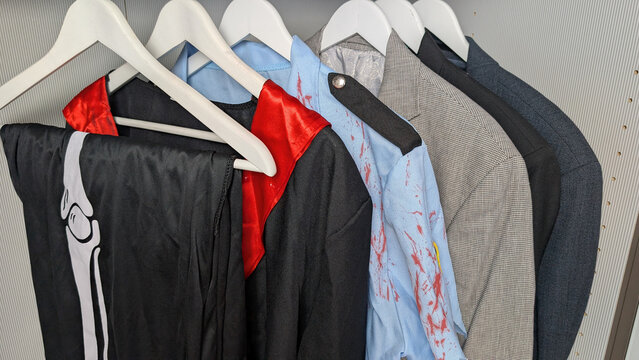 Halloween costumes stored in a wardrobe with everyday clothes. 
