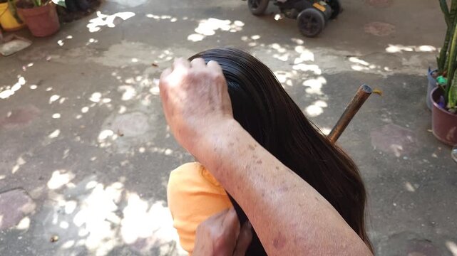 Woman Hands Combing and Checking Girl Long Hair