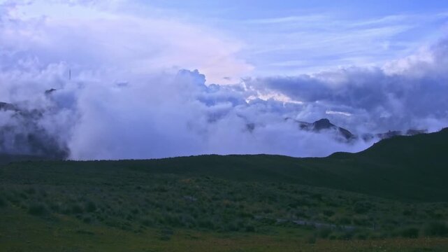 Los Nevados National Natural Park Colombia, Parque de Los Nevados, dramatic clouds and fog rolling over Andean mountain peaks and paramo hills, Cordillera Central, Andes, South America 4K