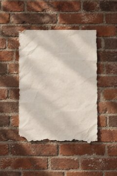 Vertical Deckled Edge Paper Sheet Mockup Mounted on Vintage Red Brick Wall