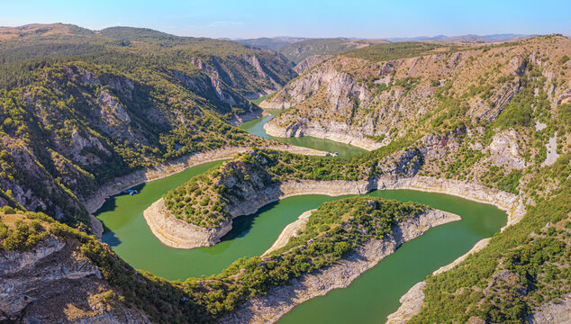 Travel destination: turquoise river meanders through a deep Uvac canyon in Serbia. Adventure and nature concept.