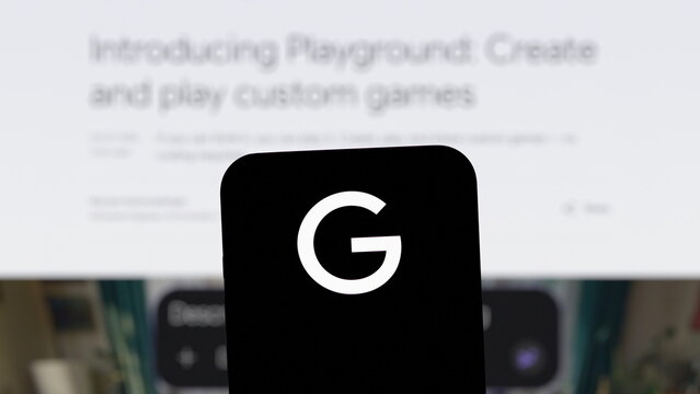 Front view of the Google logo displayed on a smartphone with the official announcement page on a computer screen in the background. October 7, 2026, Lisbon, Portugal.