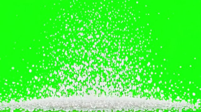 White granulated sugar particles falling and scattering across a vibrant green screen background with slow motion physics for compositing