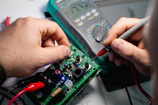 Speaker Circuit Board Testing with Digital Multimeter Close-Up