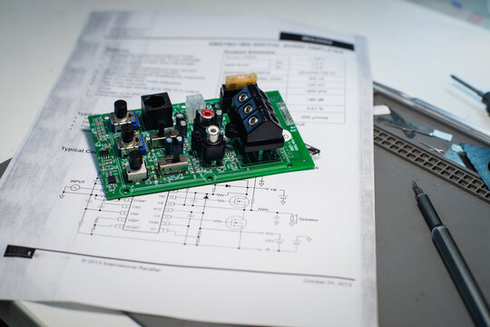 Audio Circuit Board on Printed Electronic Schematic on Repair Mat

