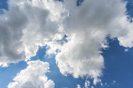 Large white clouds against a blue sky