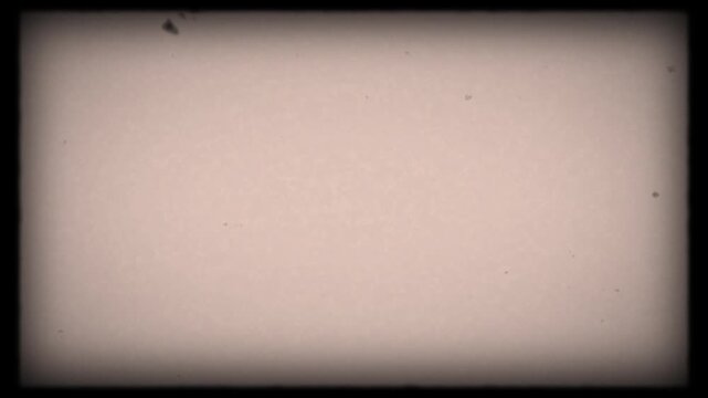 Vintage super 8 mm film blinking frame with noise dirt vintage. 8 mm film frame and texture. Nostalgic video effect.