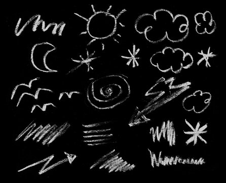 Hand drawn white chalk weather and nature symbols set on black background isolated illustration