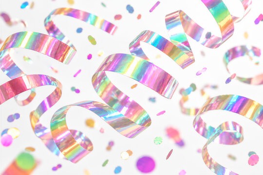 Colorful holographic streamers and confetti falling against white background, shimmering iridescent ribbons in motion. Celebration, party, festive event, anniversary decoration.
