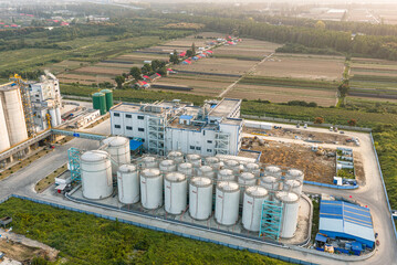The Wuhan National Rice Trading Center, featuring modern bulk grain silos and conveyor belts in an aerial view, is a vital logistics hub ensuring national food security. © 晨啸 周