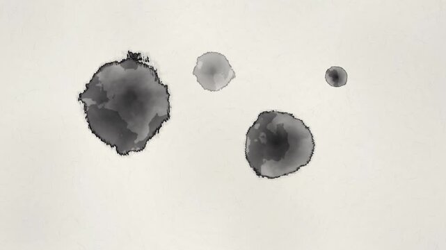 Black ink drops falling one after another on Japanese washi paper and spreading with soft bleeding edges 4k