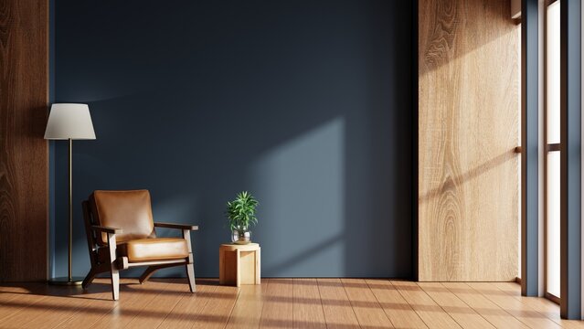Modern living room with navy blue accent wall and leather armchair- 3D rendering