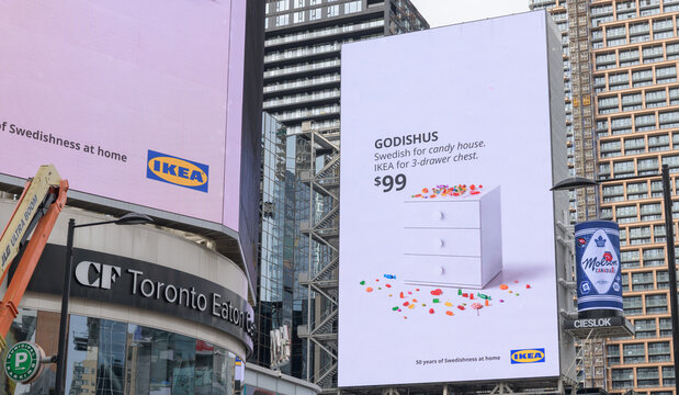 large-format electronic billboard featuring Ikea advertising facing Sankofa Square, Toronto