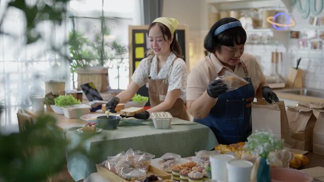 Cooking Baking Kitchen Live Streaming Online with Two Asian Women Preparing Decorated Pastries and Fresh Bread Together During Cheerful Adult Home Culinary Lesson Workshop