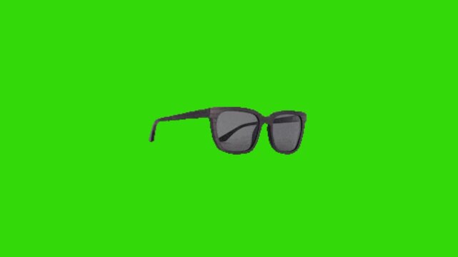 glasses on green background