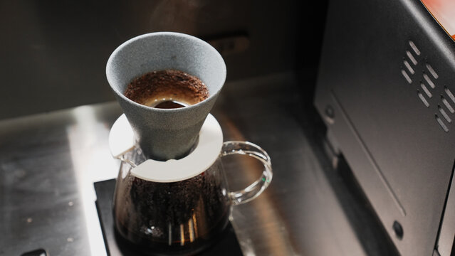 Pour over coffee brewing on a glass server