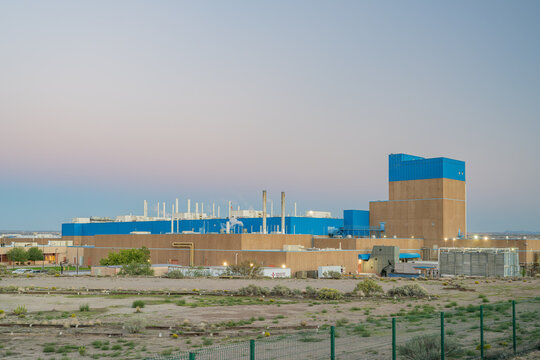 Industrial power plant facility in desert landscape