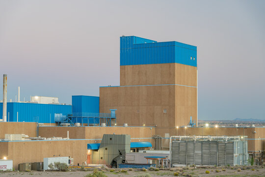 Industrial Power Plant with Blue Cladding in Desert Landscape