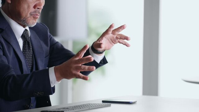 A male business person operating a screen in mid-air. VR, virtual, operation, touch, office, business, development
