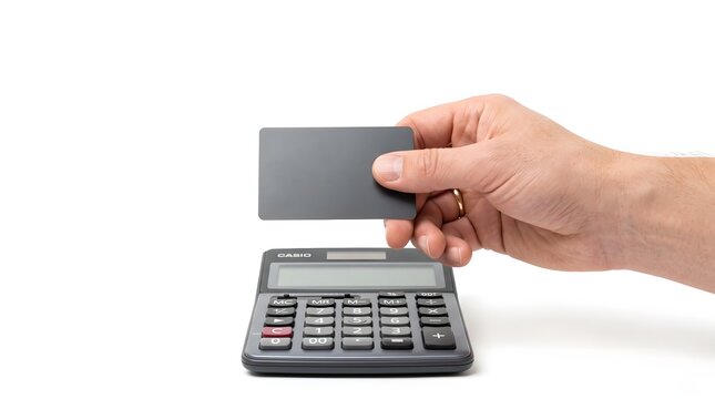 A hand holds a bank card above a calculator, representing personal finance, cashless payment, online shopping, budgeting, banking services, and everyday money management.