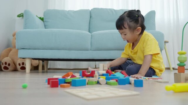 Happy Asia children play and learn toy blocks.family is happy and excited in the house. daughter having fun spending time, Activity, development, IQ, EQ, meditation, brain, muscles, essential skills.