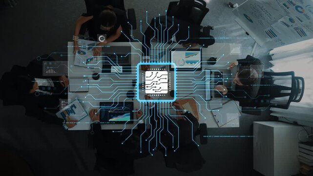 Overhead view of a business meeting featuring professionals collaborating with laptops and charts, showcasing a blend of technology and teamwork in a modern office setup. Raster