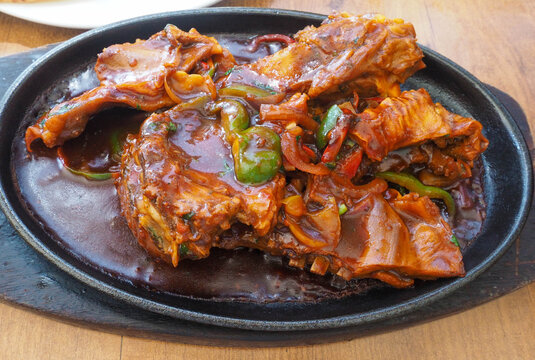 Sizzling Goat Ribs Mandi Style Served on a Hot Cast Iron Platter, Traditional Somali Arabic Cuisine Food Footage
