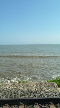 Ocean Waves Rolling Toward Rocky Shoreline
