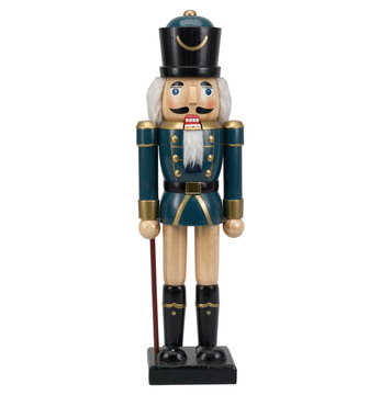 Wooden nutcracker soldier figurine in teal and gold uniform