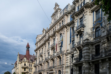 Riga, Latvia – View of street intersection and corner turret from street level, showing Art Nouveau building facades and historical architecture in Old Town (Vecrīga) city center district. © Mltz