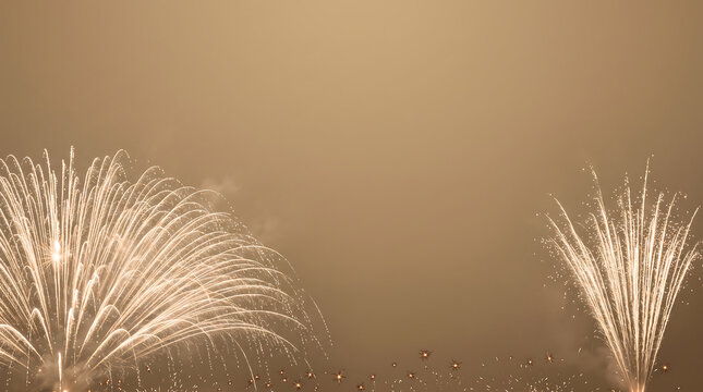 Golden fireworks exploding in the night sky celebration and festive display