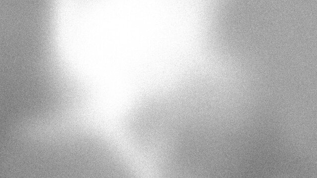 Bright white diagonal glow on grainy silver gray backdrop