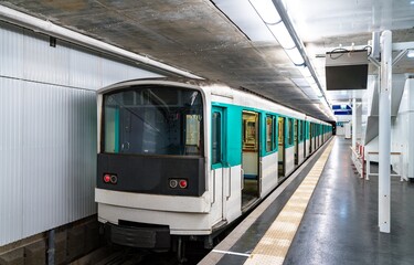 Fototapeta premium Train at Mairie d'Aubervilliers metro station in Paris, France on July 20, 2022.