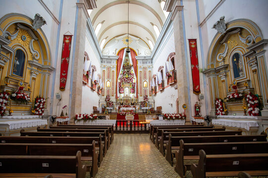 Interior view of Igreja de Nossa Senhora dos Remedios in historic Paraty Brazil showing pews and altar