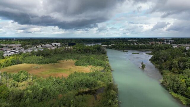 Aerial over Twelve Mile Creek in the Martindale area of St. Catharines, Ontario, Canada on a summer morning with mixed clouds and sunshine in September, 2024.