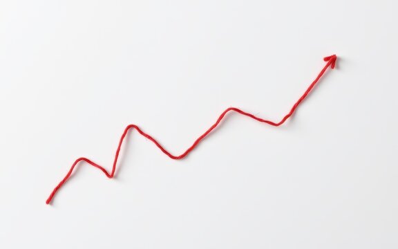 Red thread forming an upward trending arrow symbolizing growth and progress.