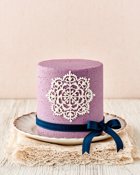 Purple Ube Cake with Edible Lace Decoration on Vintage Porcelain Plate