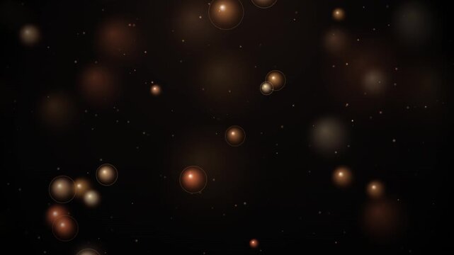 Abstract bronze and copper bokeh lights floating on a dark background