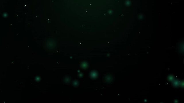 Abstract emerald green bokeh particles floating in dark space