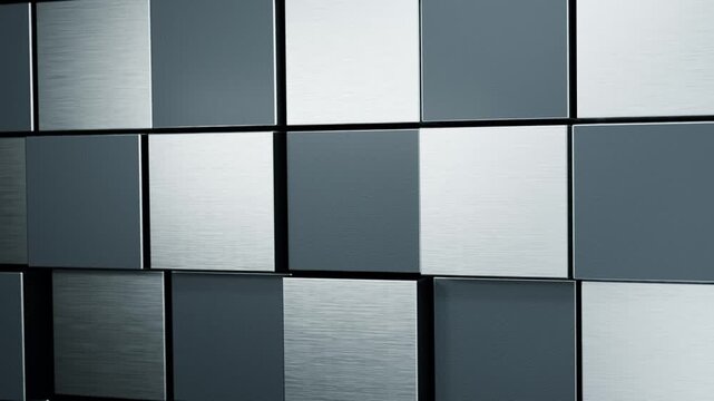 黒鉛とプラチナの質感を見せる四角形タイルが前後に動くループ動画。企業広告や製品紹介の背景に映える金属質感のシネマティック素材