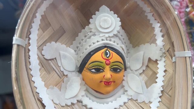 hindu goddess durga inside a bamboo winnowing fan in kolkata.