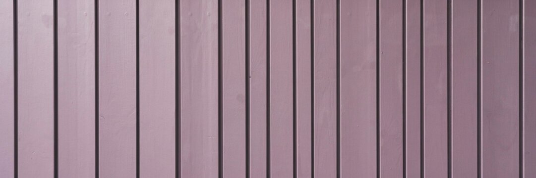 background Purple wooden slat wall texture background, vertical lavender painted timber wood paneling surface, modern violet wooden fence cladding backdrop for graphic design projects