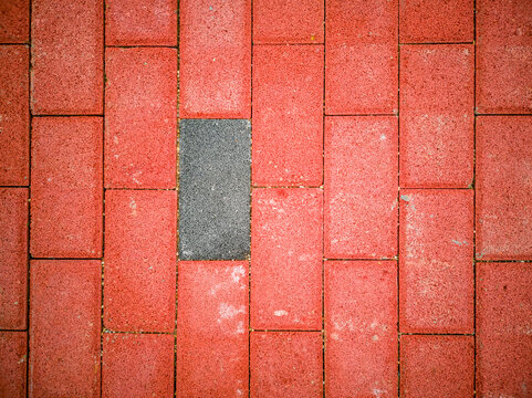 Red floor tiles with gray tiles embedded in between