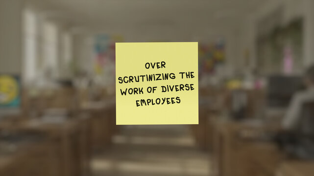 Memo with the script "over scrutinizing the work of diverse employees" in the front, superimposed on a blurred background showing an open seating environment.