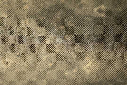 old metal plate, Close-up of the repeating pattern on the surface of the old rubber piece.