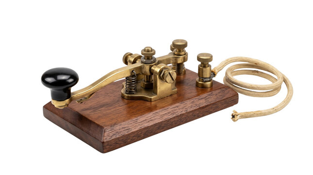 Vintage brass telegraph key on wooden base, antique morse code transmitter, classic telecommunication device studio shot